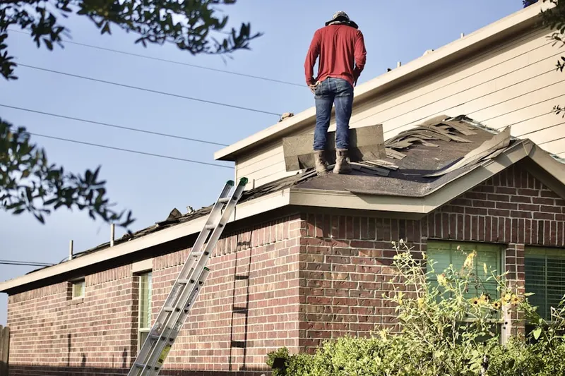Professional roofer working on a residential roof in Blue Lakes
